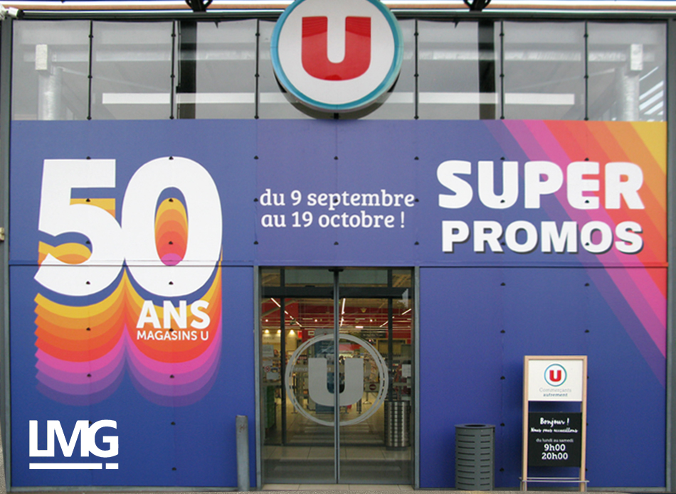 photo habillage adhésif sur façade vitrée magsin Super U Flourens Le Mouvement Graphique